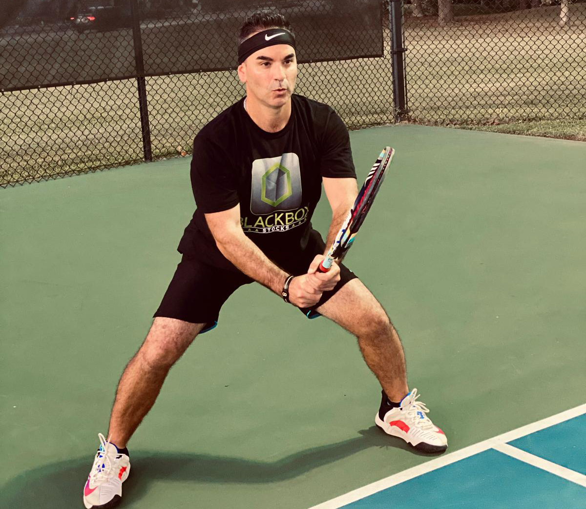 Coach Brady Mazzola in action on the tennis court